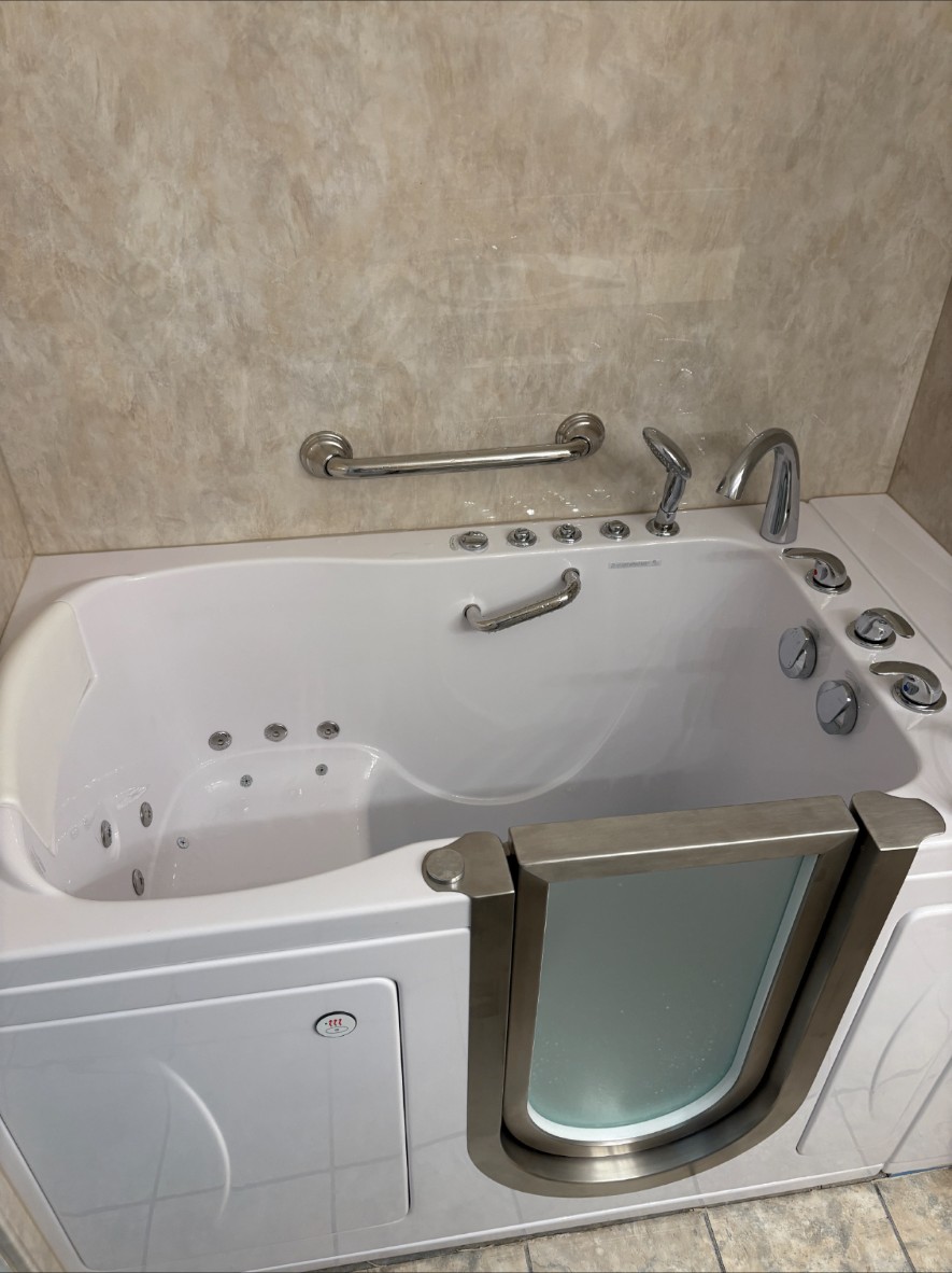 Finished walk-in tub with grab bars and handheld sprayer